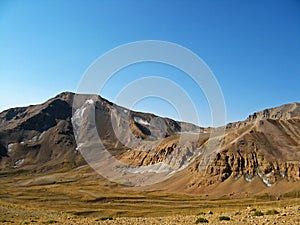 Hesarchal plain and Lashgarak summit in mount Alamkuh , Iran photo