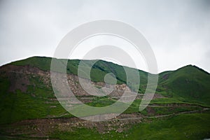 Landscape high mountains in dense fog tops of mountains in clouds North Caucasus Elbrus