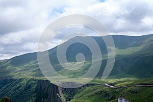 Landscape high mountains in dense fog tops of mountains in clouds North Caucasus Elbrus