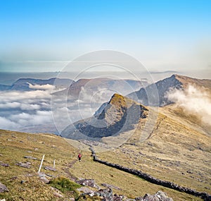 Landscape with hiker in Brandon mountains in spring