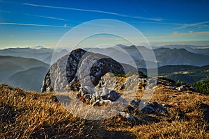 landscape of hiking paradise Schneeberg, mountain peak with mountain, rocks, clouds, and blue sky