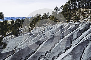 Landscape hill with gray marls with abstract shapes