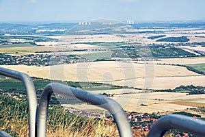 Krajina z vrchu Zobor pri Nitre, Slovensko, v diaľke jadrová elektráreň Mochovce