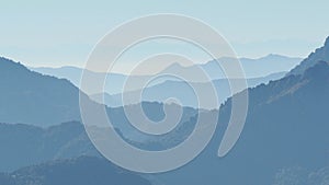 Landscape on hills and Alps mountains with humidity in the air and pollution