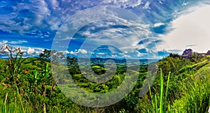 Landscape of hills with blue sky. Hills in the mountainous region of Minas Gerais, Brazil, under a blue sky with clouds