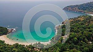 Landscape with hills, forest and beautiful tropical beach near ocean. Thailand Asia. Drone.