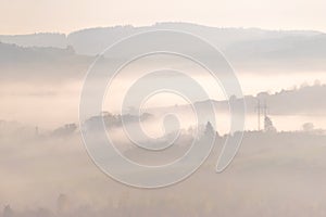 Landscape with hills in soft light and fog