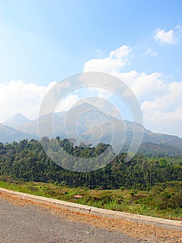 A Landscape with Hills, Trees, and a Roadside - Natural Background