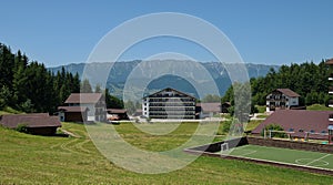 Landscape with Hotel from the Fundata Resort at Cheile Gradistei with Piatra Craiului Mountains in the background.