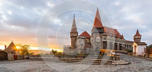 Landscape with Hunyad Corvin medieval castle in the sunrise light,