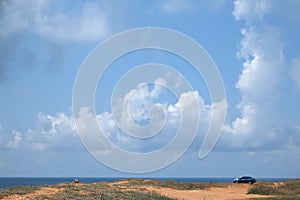 landscape with the image of clouds under the sea beach