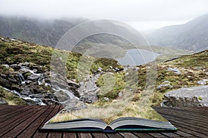 Landscape image of Llyn Idwal in Glyders mountain range in Snowdonia during heavy rainfall in Autumn coming out of pages of open