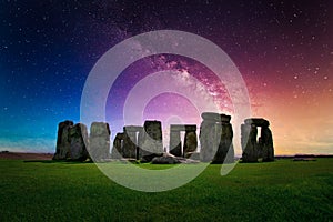 Landscape image of Milky way galaxy at night sky with stars over Stonehenge an ancient prehistoric stone monument, Wiltshire, UK
