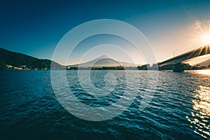 Landscape image of Mt. Fuji over Lake Kawaguchiko at sunrise in Fujikawaguchiko, Japan. Vintage tone