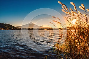 Landscape image of Mt. Fuji over Lake Kawaguchiko at sunset in Fujikawaguchiko, Japan