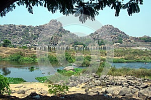 Landscape image of ruined city hampi and tungabhadra river