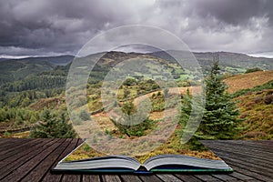 Landscape image of view from Precipice Walk in Snowdonia overlooking Barmouth and Coed-y-Brenin forest coming out of pages in