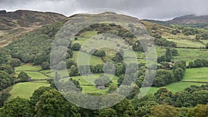 Landscape image of view from Precipice Walk in Snowdonia overlooking Barmouth and Coed-y-Brenin forest during rainy afternoon in