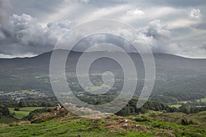 Landscape image of view from Precipice Walk in Snowdonia overlooking Barmouth and Coed-y-Brenin forest during rainy afternoon in