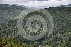 Landscape image of view from Precipice Walk in Snowdonia overlooking Barmouth and Coed-y-Brenin forest during rainy afternoon in