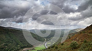 Landscape image of view from Precipice Walk in Snowdonia overlooking Barmouth and Coed-y-Brenin forest during rainy afternoon in