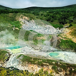 Landscape of the Island of Iturup with springs of sulphuric water. Kurils, Russia.