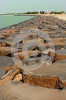 Landscape of karaikal beach with stone way and light house.
