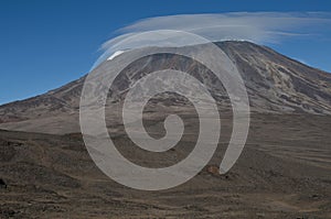 Landscape of the Kibo volcanic cone of Mount Kilimanjaro under sunlight