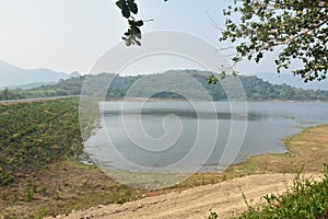 landscape of Klong bot water reservoir lake with mountain background in Thailand