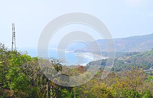 Landscape in Konkan Region in India - Sea, Beach, and Green Hills photo