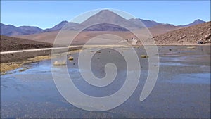 Landscape of lagoon, mountains and salt flats in Atacama desert, Chile