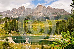 Landscape of Lake Carezza or Karersee and Dolomites in background, Nova Levante, Italy