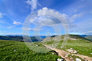 Landscape in the lake district, England. Hiking path in the mountains. Mountains and blue sky landscape. Lake District