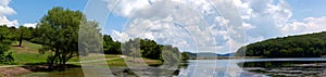 Landscape with lake forest, mountain and blue sky