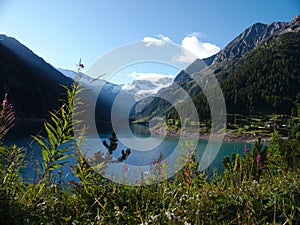Landscape with lake, mountains and blue sky photo