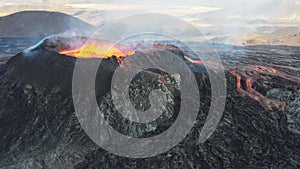 Landscape of lightening erupting Mauna Loa Volcano in Hawaii with smoke and blue horizon sky