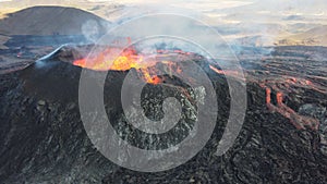 Landscape of lightening erupting Mauna Loa Volcano in Hawaii with smoke and blue horizon sky