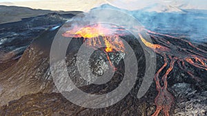 Landscape of lightening erupting from Mauna Loa Volcano in Hawaii with smoke and a hazy sky