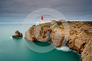 Landscape of the lighthouse and cliffs at Cape St. Vincent at sunset. Algarve amazing seascape.  Continental Europe`s most South-