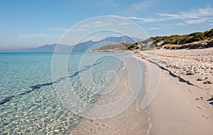 Landscape limpid turquoise water, white sand beach and blue sky photo