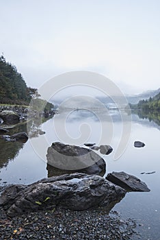 Landscape of Llyn Crafnant during foggy Autumn morning in Snowdonia National Park