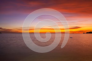 Landscape Long exposure of majestic clouds in the sky sunset or sunrise over sea with reflection in the tropical sea Beautiful