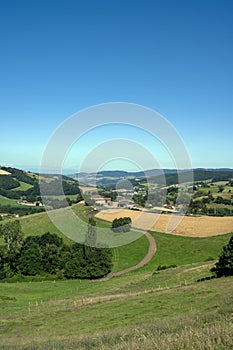 Landscape of the Lyonnais mountains around the village of Montrottier in summer in France