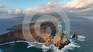 landscape on Madeira island. Atlantic ocean waves crashing over the rocks