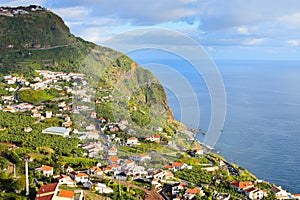 Landscape with Madeiran coastal village photo
