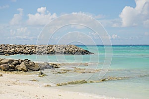 Landscape Maldive island blue ocean white sand and stones ashore