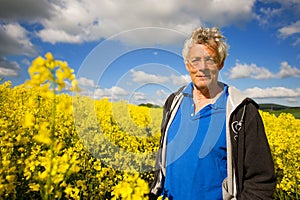 Landscape with man in cole seed