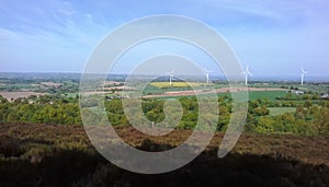 Landscape of the Mancelles Alps near Gesvres in Mayenne wind turbine field