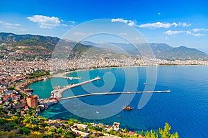 Landscape with marina and Kizil Kule tower in Alanya peninsula, Antalya district, Turkey, Asia. Famous tourist destination with