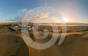 Landscape with Maspalomas town and golden sand dunes at sunrise, Gran Canaria, Canary Islands